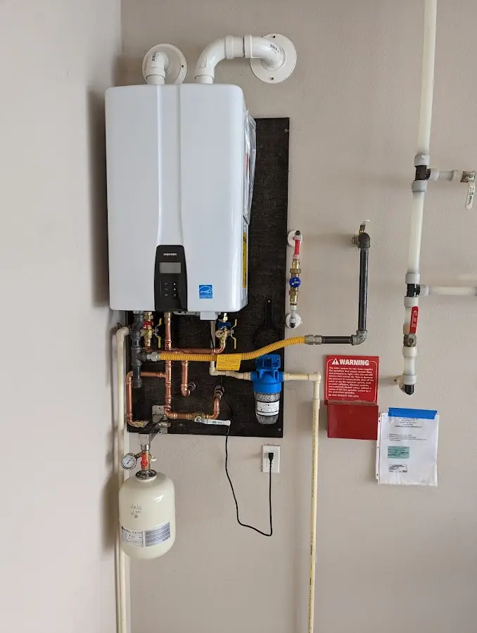 Professional plumber installing copper piping in a Centralia home